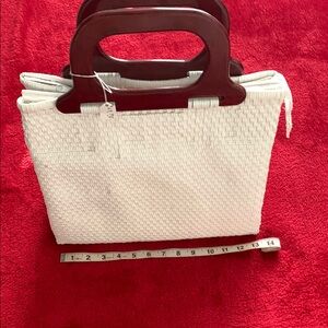 Elegant White and Brown  woven Tote with wooden handles.